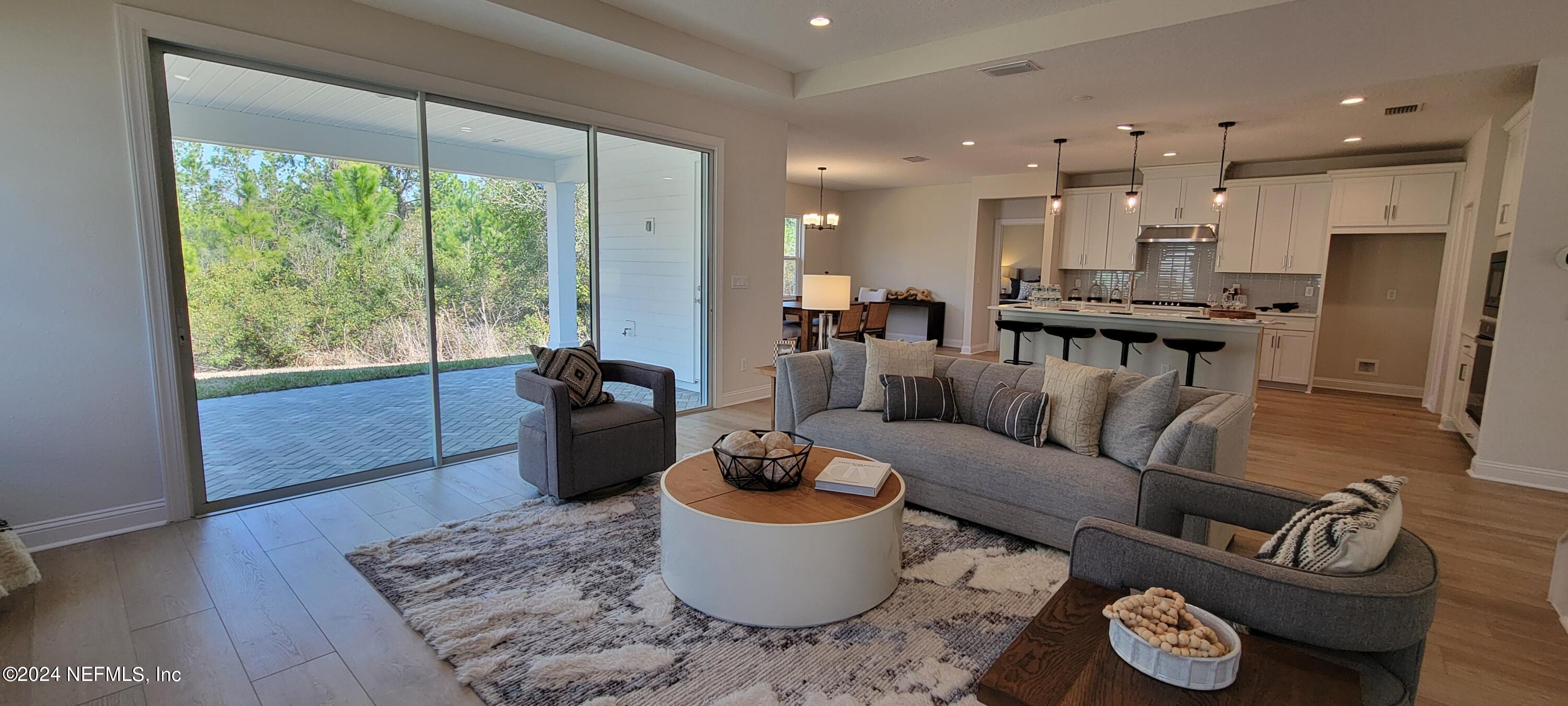 307 Ranch Land Circle St. Johns, FL 32259 - Photo 8 of 95 a living room with furniture and a large window