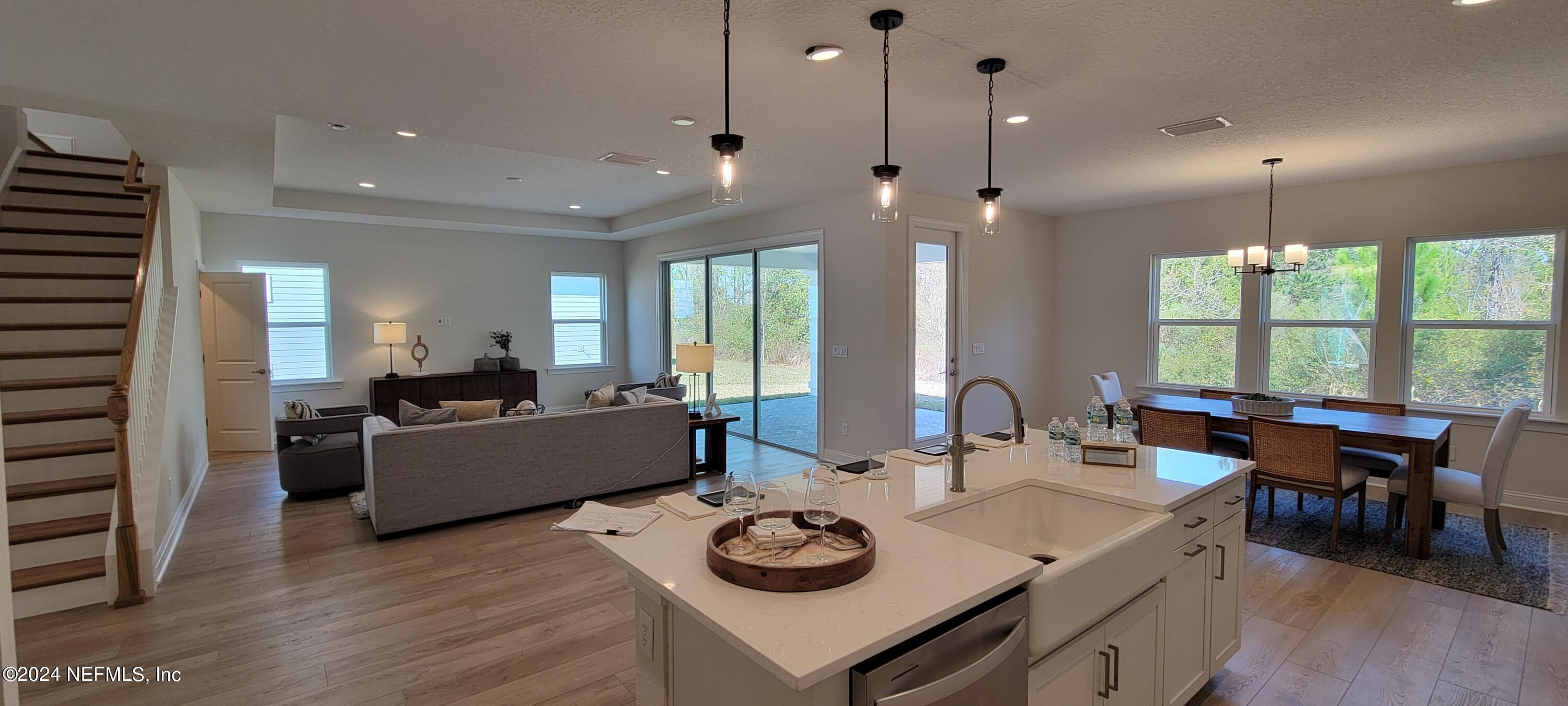307 Ranch Land Circle St. Johns, FL 32259 - Photo 10 of 95 a living room with furniture and a large window