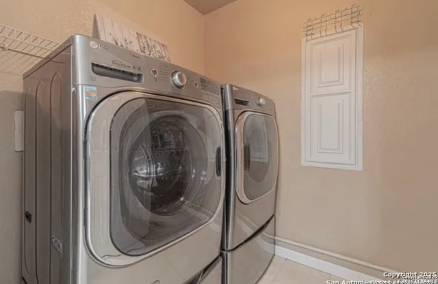 a utility room with dryer and washer