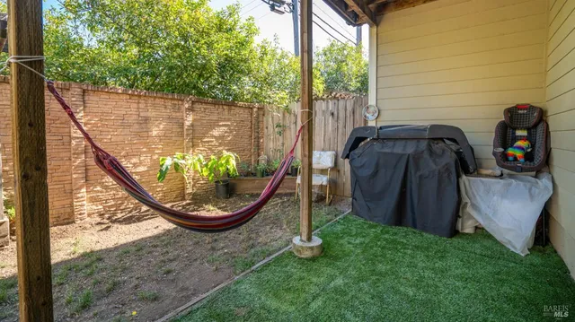 a view of a lake with a floor to ceiling window and yard