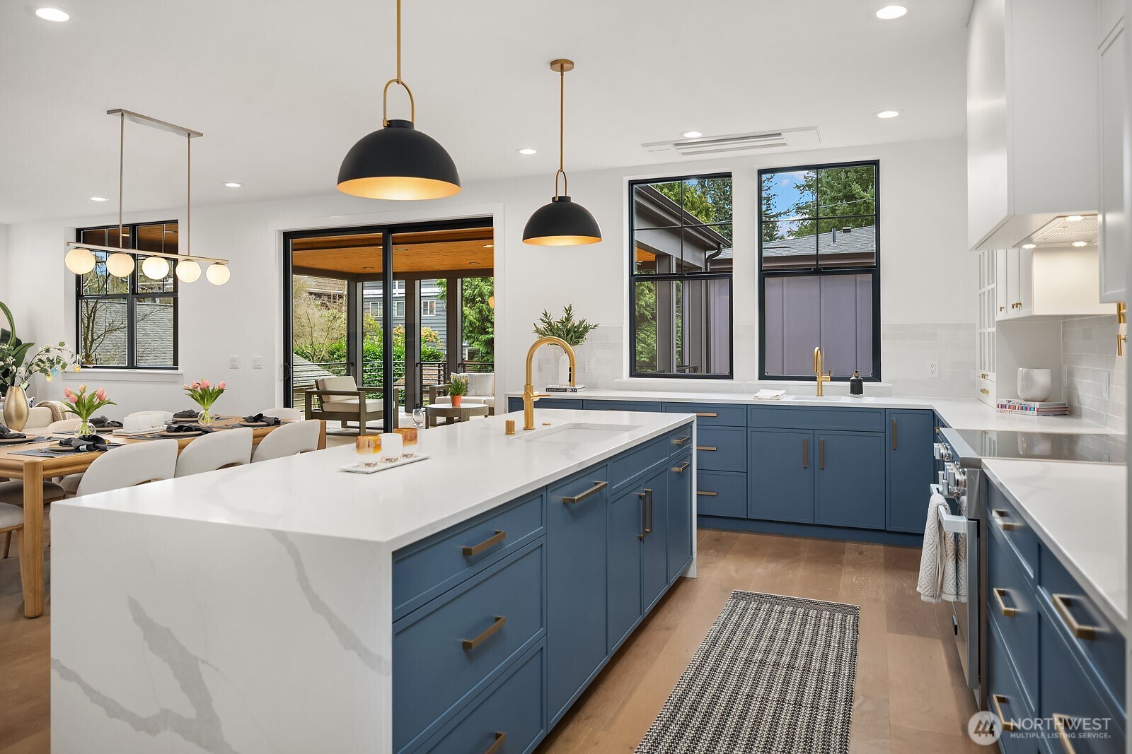 2615 Northeast 87th Street Seattle, WA 98115 - Photo 13 of 40 a kitchen with a sink stove and wooden floor