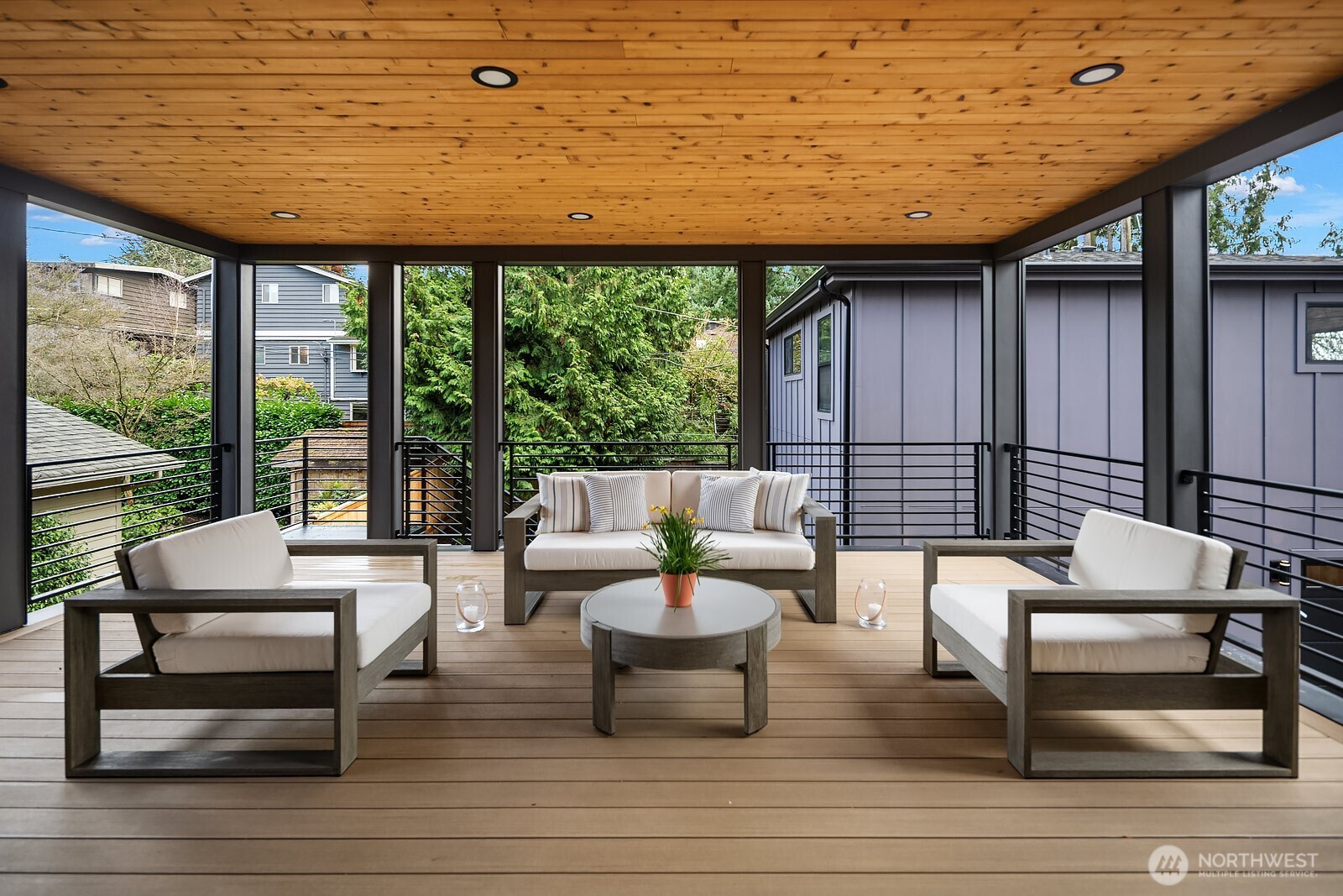 2615 Northeast 87th Street Seattle, WA 98115 - Photo 15 of 40 a outdoor living space with patio furniture and a potted plant