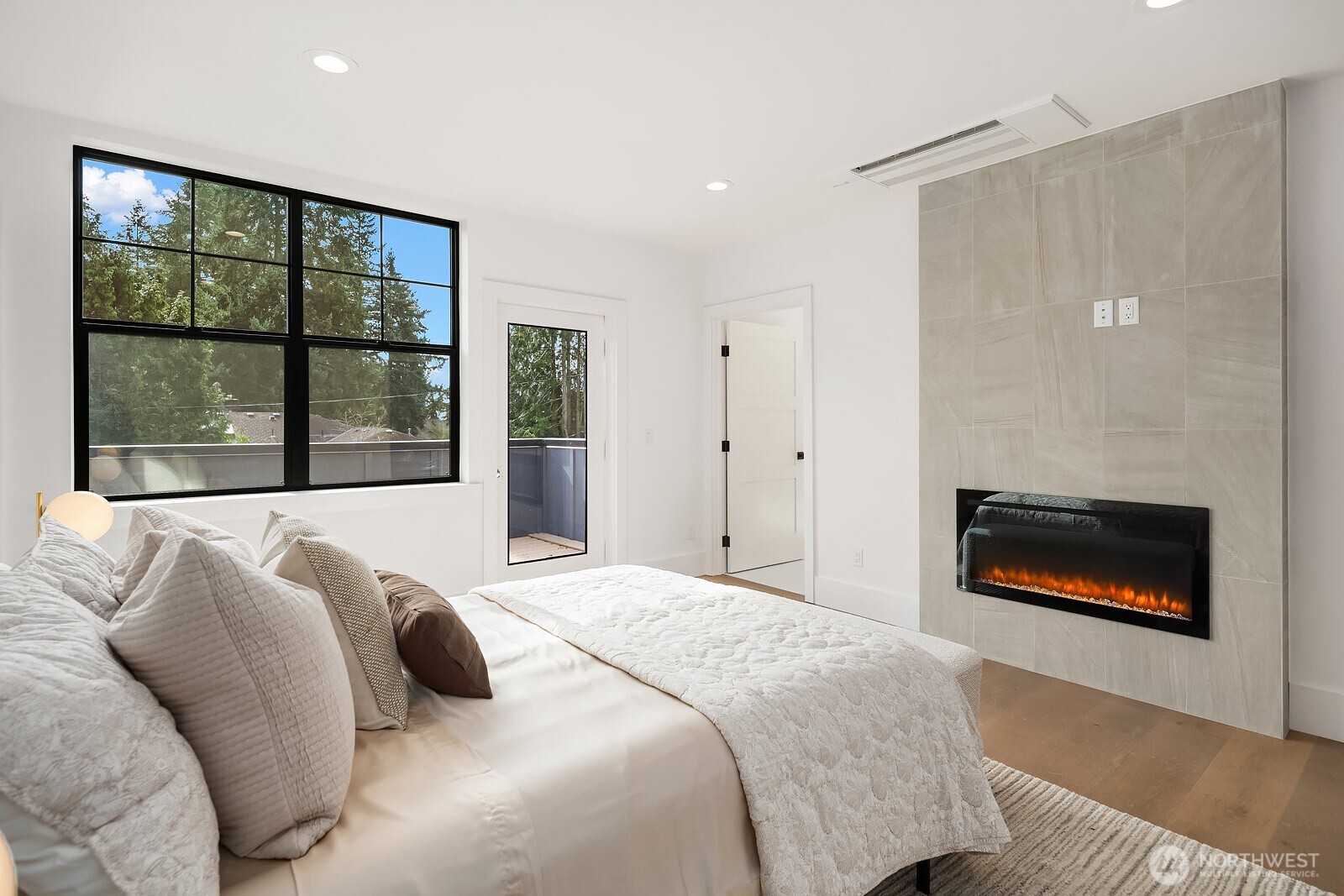 2615 Northeast 87th Street Seattle, WA 98115 - Photo 19 of 40 a bedroom with a bed and a fireplace