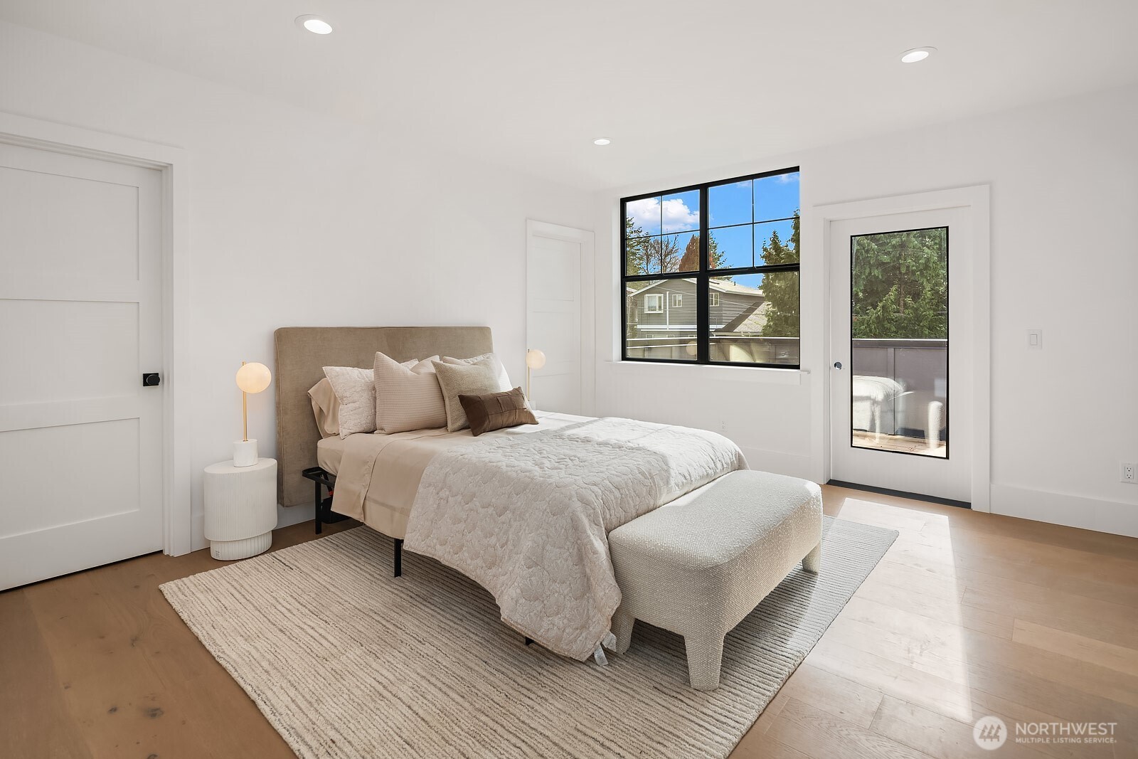2615 Northeast 87th Street Seattle, WA 98115 - Photo 20 of 40 a spacious bedroom with a bed and a large window