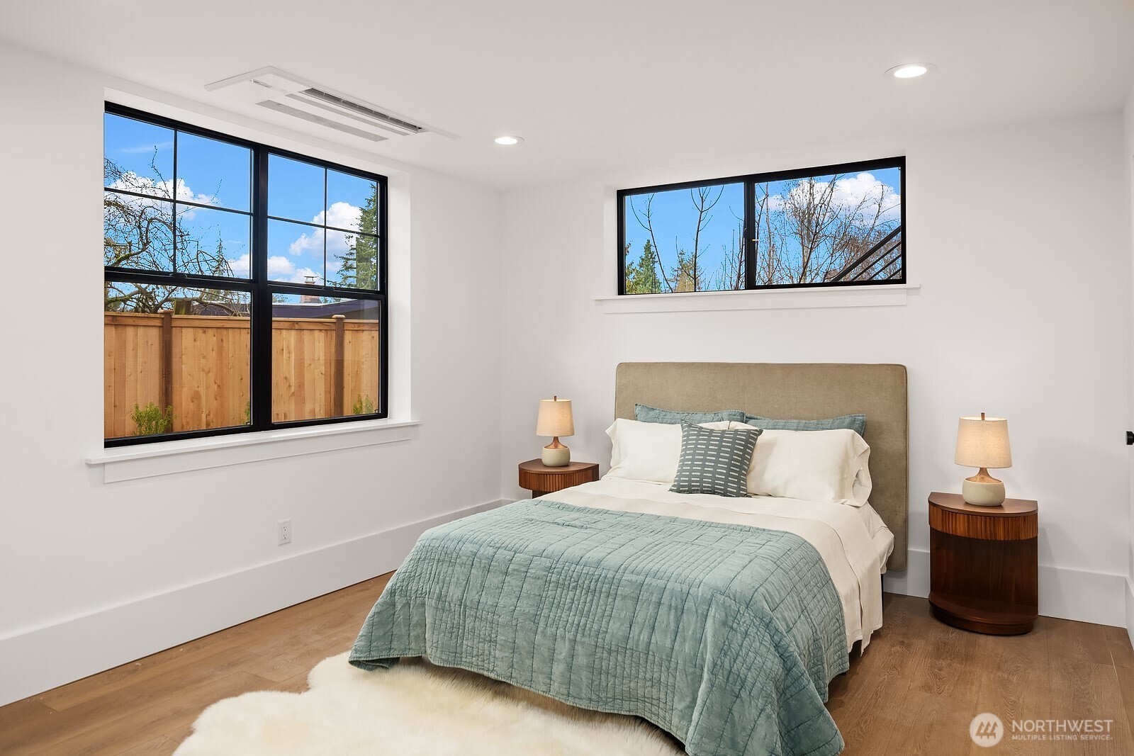 2615 Northeast 87th Street Seattle, WA 98115 - Photo 34 of 40 a bedroom with a large bed and a window