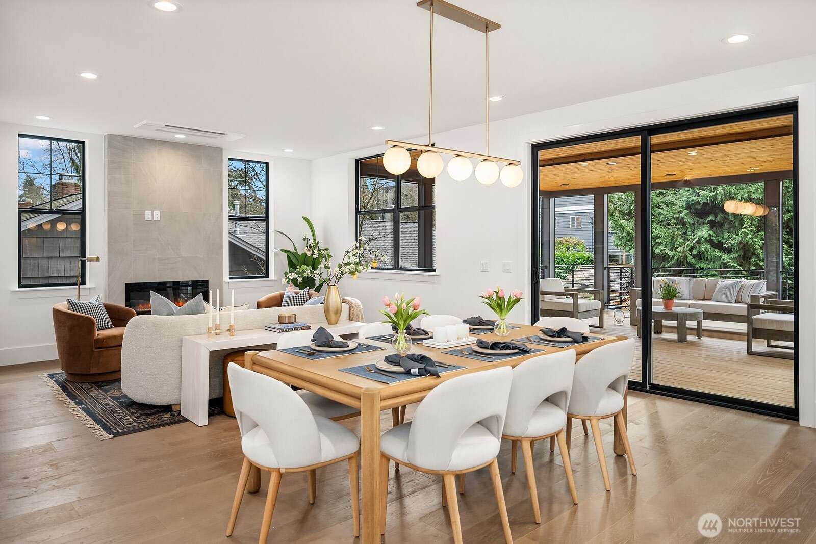 2615 Northeast 87th Street Seattle, WA 98115 - Photo 5 of 40 a dining room with furniture a chandelier and wooden floor