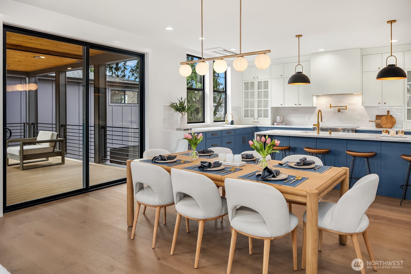 2615 Northeast 87th Street Seattle, WA 98115 - Photo 8 of 40 a dining room with furniture a chandelier and wooden floor