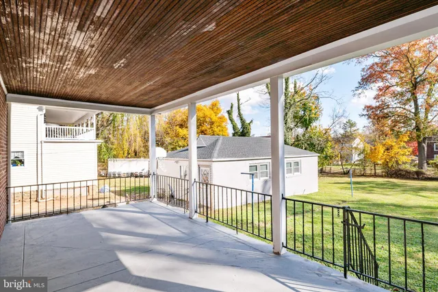 a view of a porch with wooden floor and outdoor space