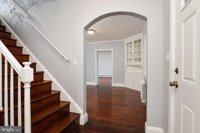 a view of an entryway with wooden floor