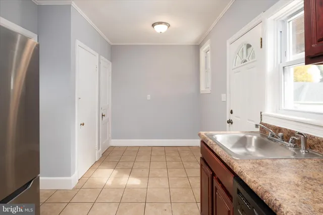 a bathroom with a granite countertop sink a mirror and shower
