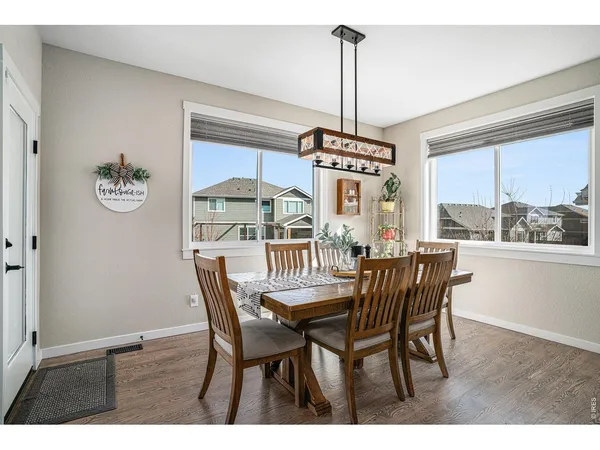 a view of a dining room with furniture window and outside view