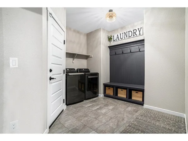 a kitchen with stainless steel appliances a refrigerator and a stove