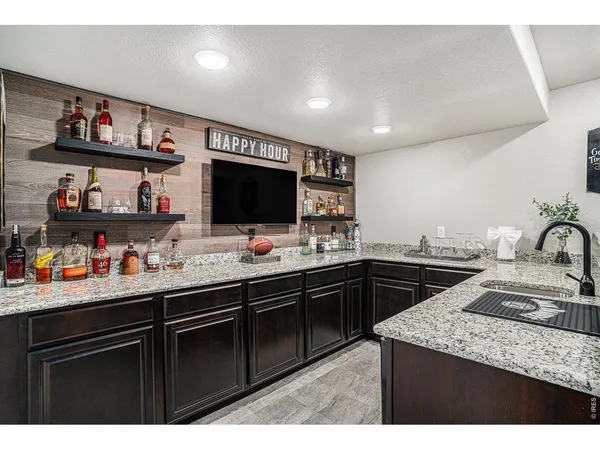 a kitchen with sink cabinets and window