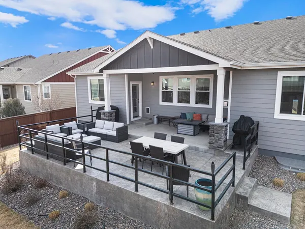 a patio with patio a couch and chairs