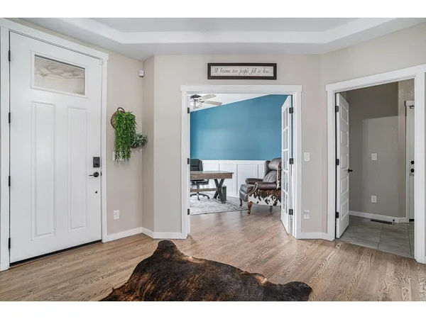 a view of livingroom with hardwood floor and hallway