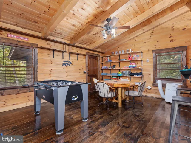 a view of a room with bed and a window