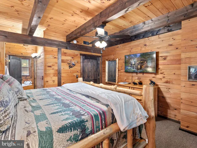 a living room with furniture and wall paintings