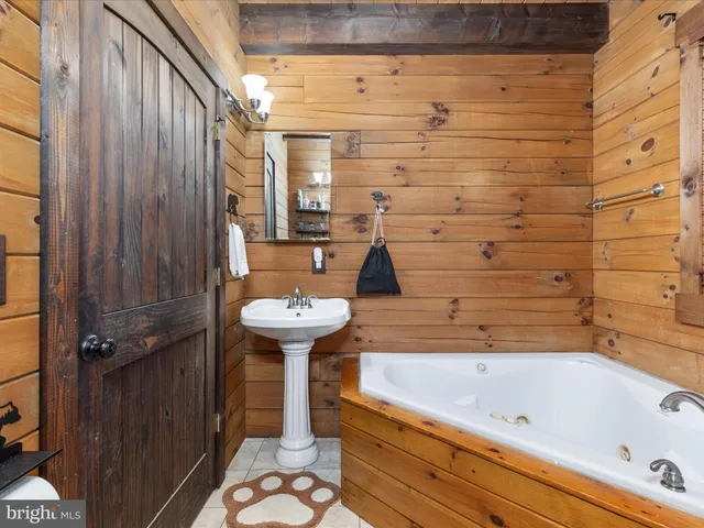 a view of a room with bed and a window