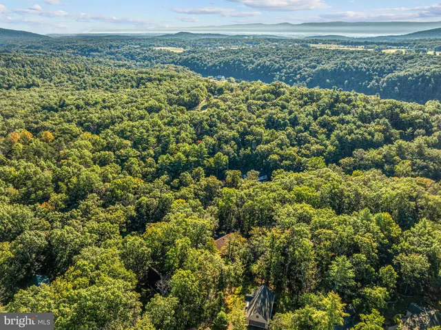 a view of a backyard with sitting area