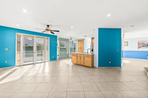a view of a kitchen with a sink and cabinets