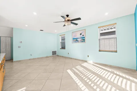 a kitchen that has a sink a counter top space and stainless steel appliances