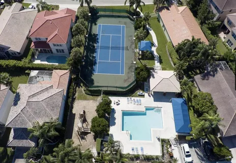 an aerial view of a house with outdoor space