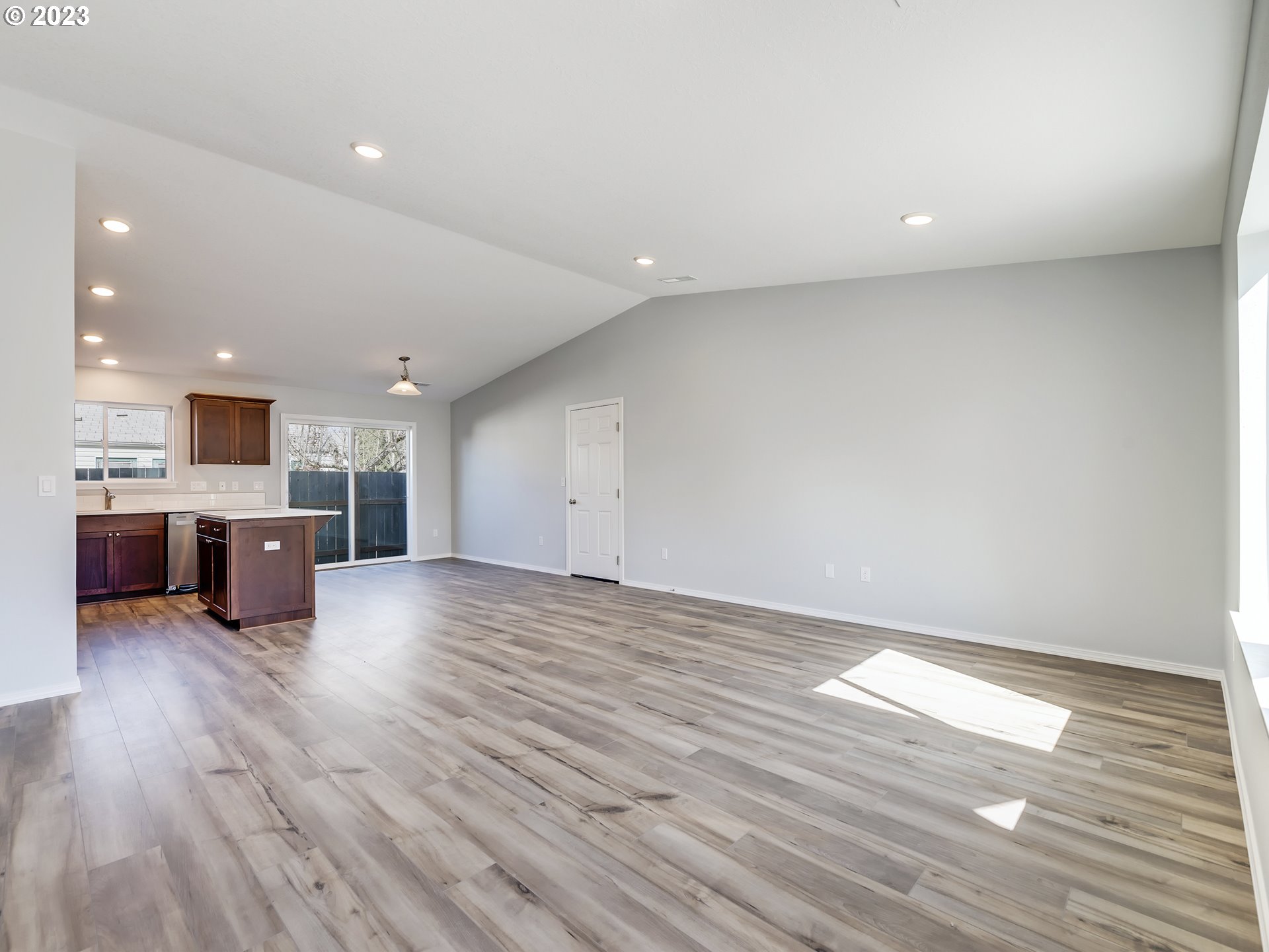 406 18th Street Springfield, OR 97477 - Photo 16 of 30 a view of kitchen with kitchen island microwave and wooden floor