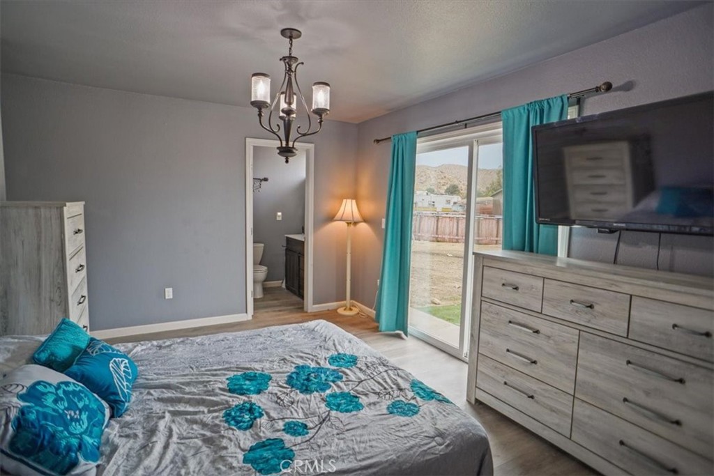 40287 Fieldspring Street Palmdale, CA 93591 - Photo 5 of 14 a bedroom with a bed and a dresser