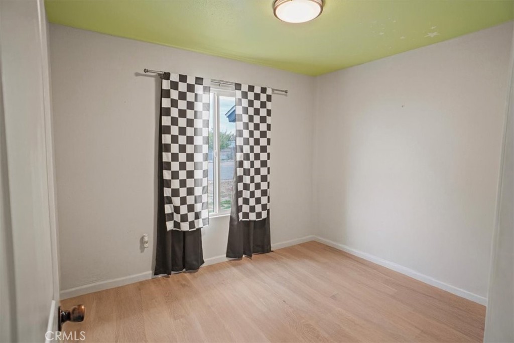 40287 Fieldspring Street Palmdale, CA 93591 - Photo 9 of 14 a view of an empty room with a window