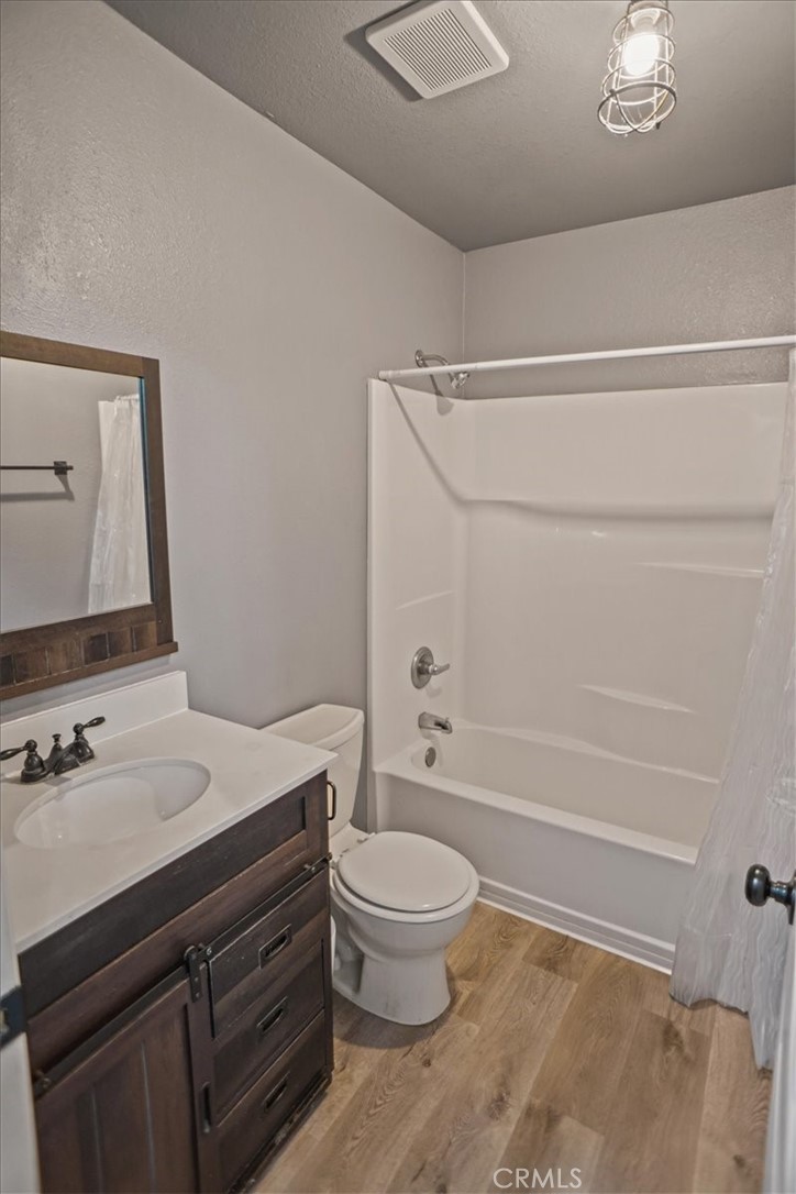 40287 Fieldspring Street Palmdale, CA 93591 - Photo 10 of 14 a bathroom with a sink a toilet and a mirror