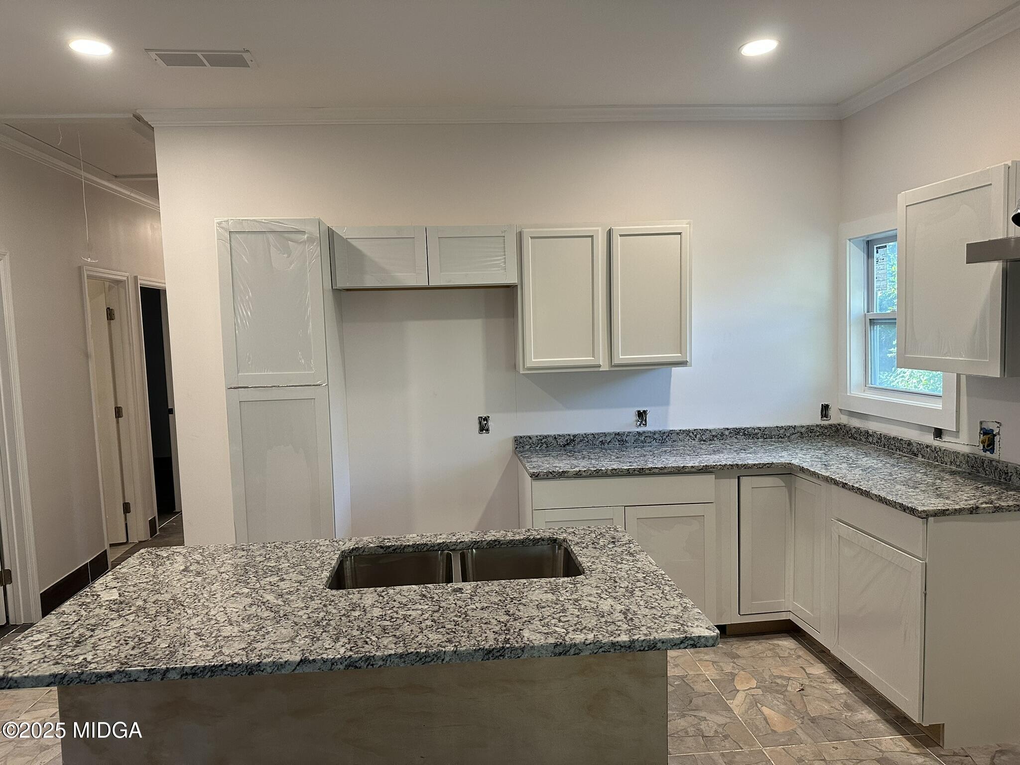 320 Lincoln Avenue Macon, GA 31201 - Photo 2 of 11 a kitchen with stainless steel appliances granite countertop a sink stove and refrigerator