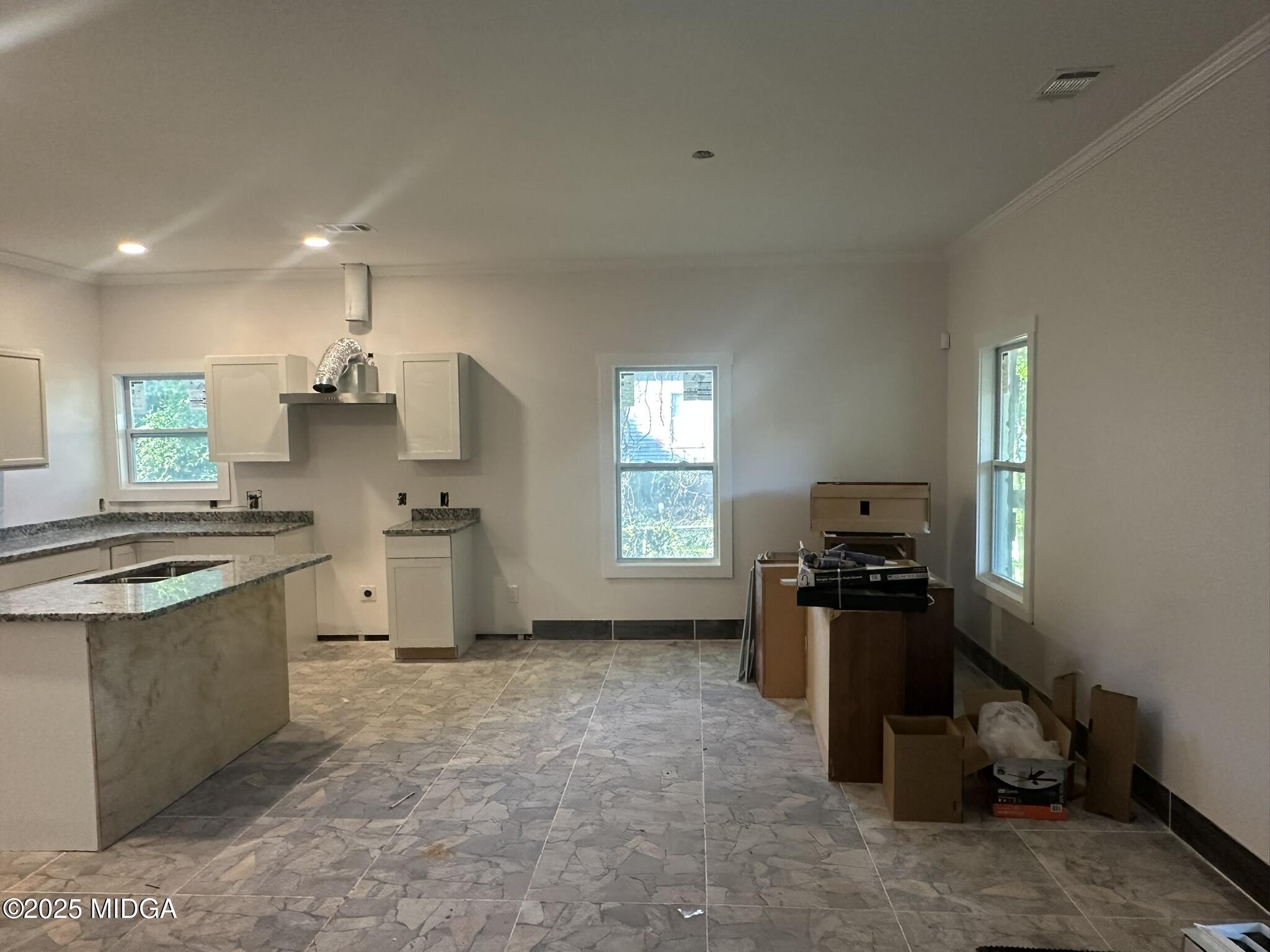 320 Lincoln Avenue Macon, GA 31201 - Photo 4 of 11 a kitchen with granite countertop a sink stove and refrigerator