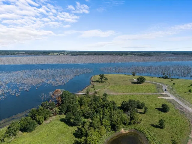 an aerial view of a golf course with ocean view