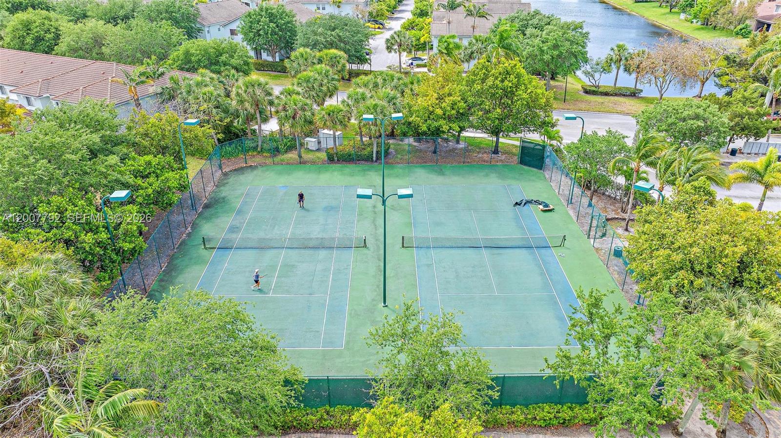 3229 Laurel Ridge Circle, Unit 3229 Riviera Beach, FL 33404 - Photo 18 of 24 an aerial view of a house with a yard