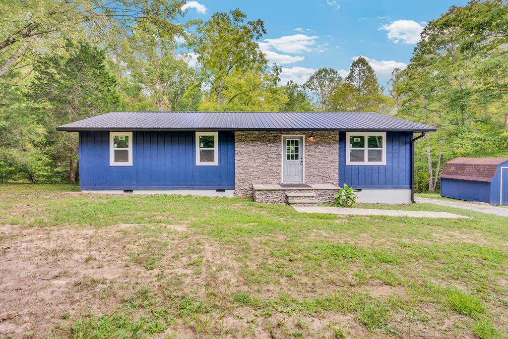a brick house with a yard