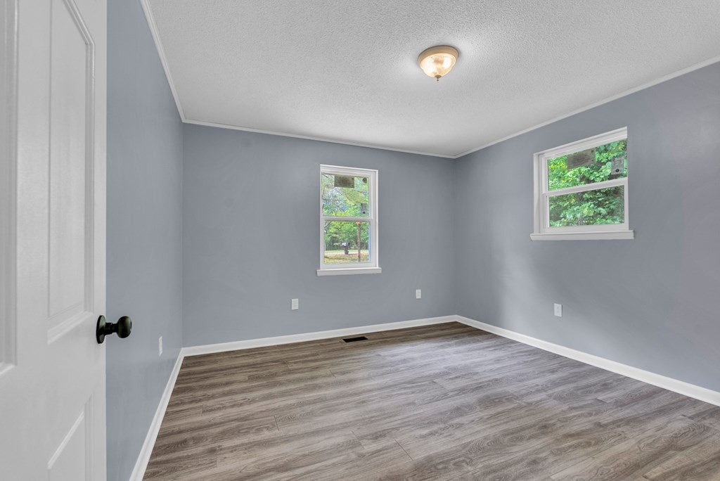 121 Twin Oaks Road Pikeville, TN 37367 - Photo 16 of 22 wooden floor in an empty room with a window