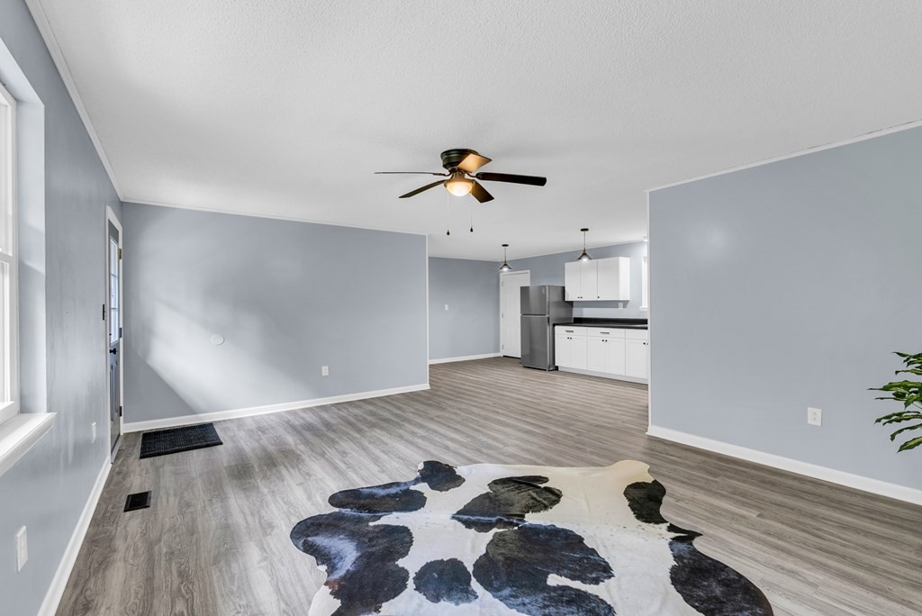 121 Twin Oaks Road Pikeville, TN 37367 - Photo 3 of 22 a view of empty room with wooden floor and fan