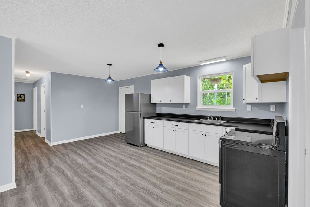 121 Twin Oaks Road Pikeville, TN 37367 - Photo 8 of 22 a kitchen with a refrigerator and window