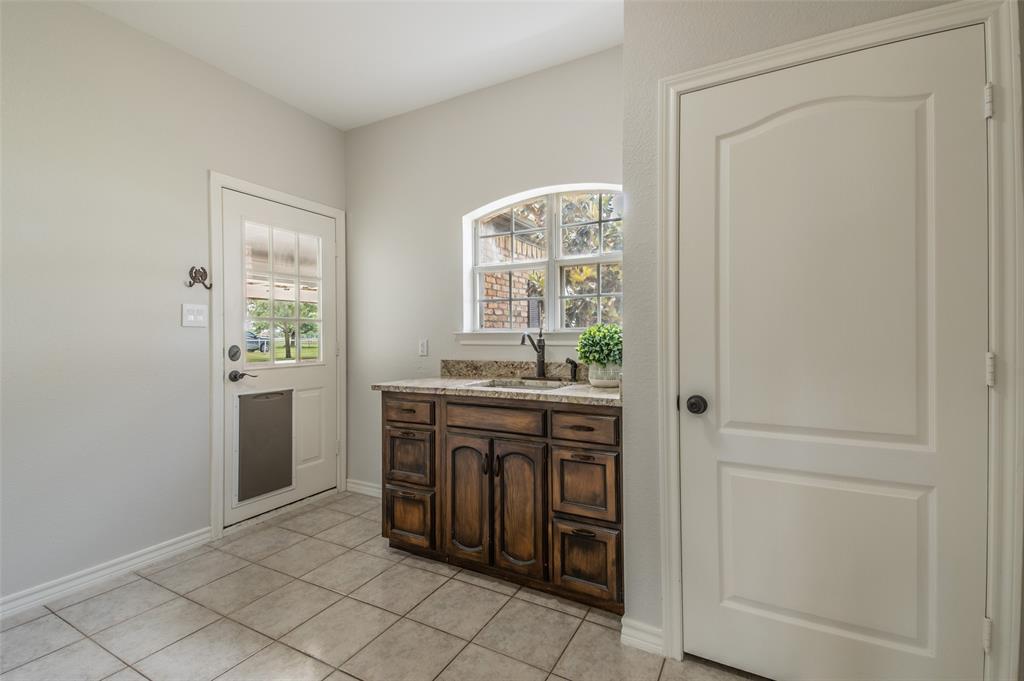 13507 Friendship Road Pilot Point, TX 76258 - Photo 19 of 39 a room with window and bathroom