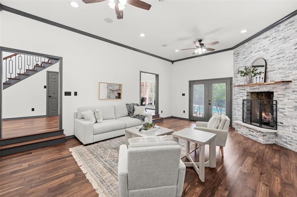 3091 Rockbridge Road McGregor, TX 76657 - Photo 17 of 40 a living room with fireplace furniture and a wooden floor