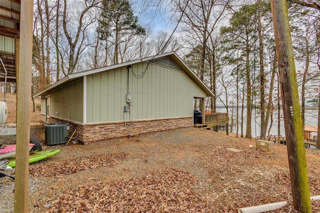 638 Featherston Road Homer, LA 71040 - Photo 2 of 10 View of side of property featuring a wooden deck and a cooling unit