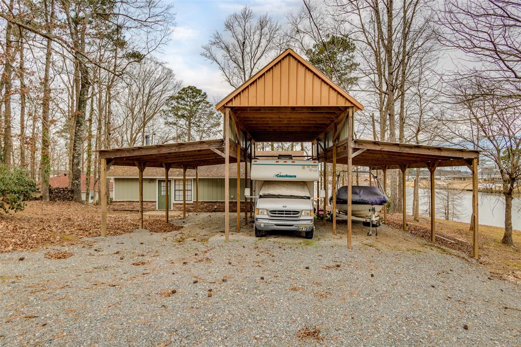638 Featherston Road Homer, LA 71040 - Photo 3 of 10 View of car parking featuring a detached carport and driveway