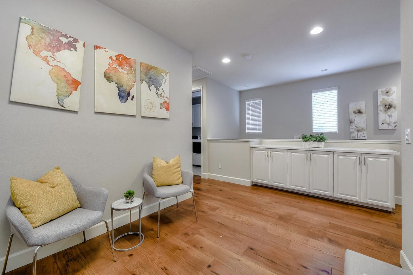 171 Cobblestone Loop Milpitas, CA 95035 - Photo 15 of 41 a kitchen with a chair and white cabinets