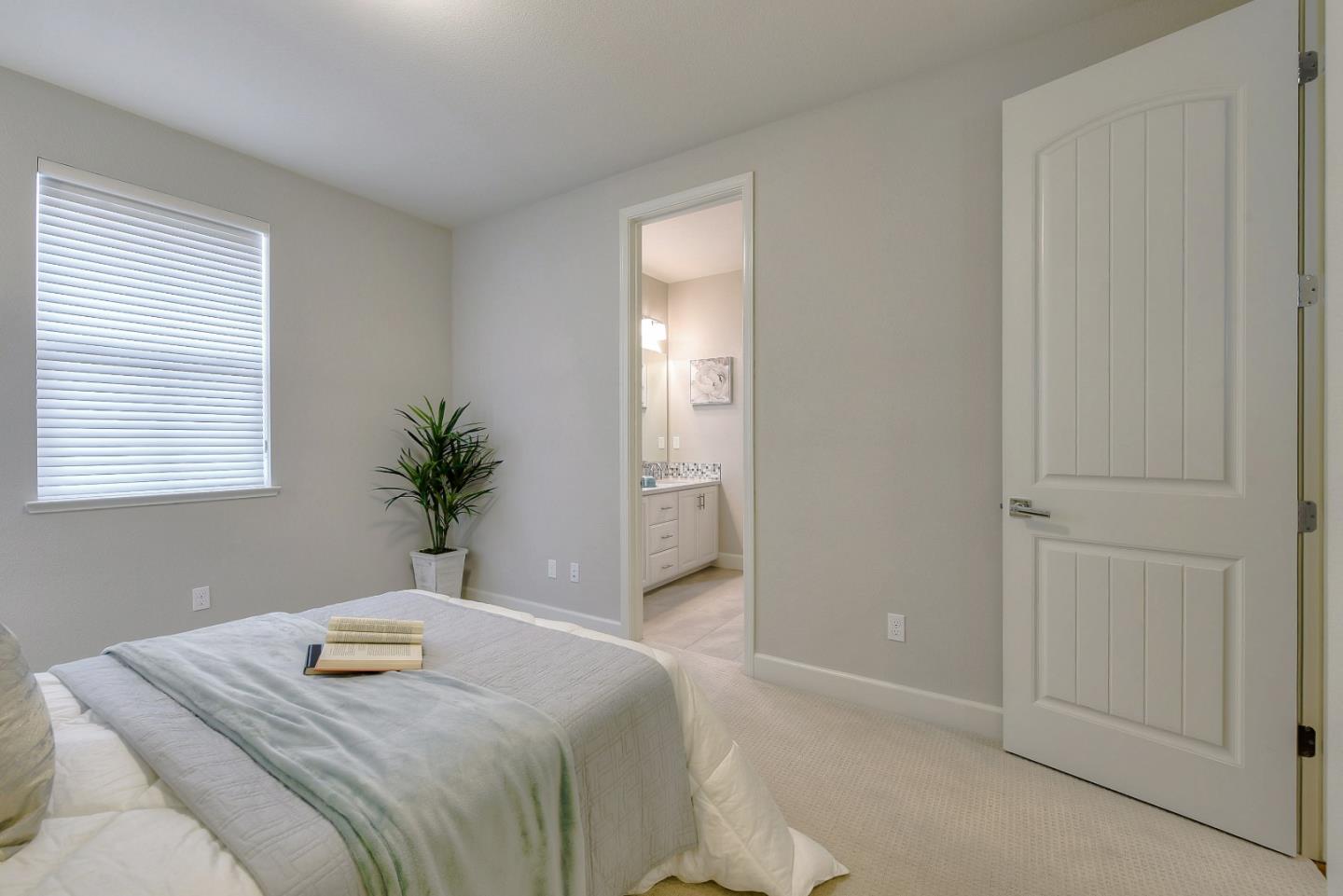 171 Cobblestone Loop Milpitas, CA 95035 - Photo 18 of 41 a bedroom with a bed and a potted plant