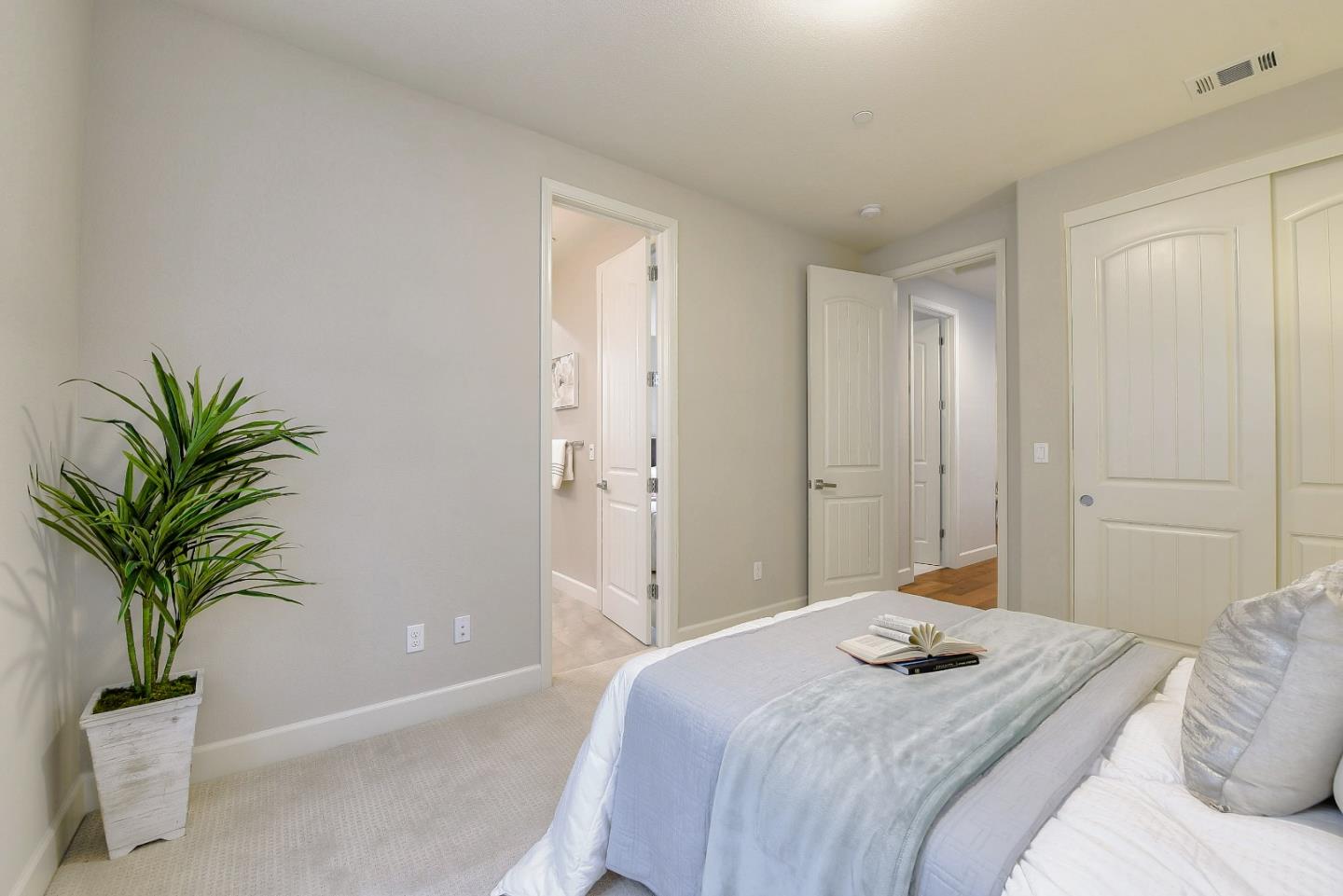 171 Cobblestone Loop Milpitas, CA 95035 - Photo 20 of 41 a bedroom with a large potted plant