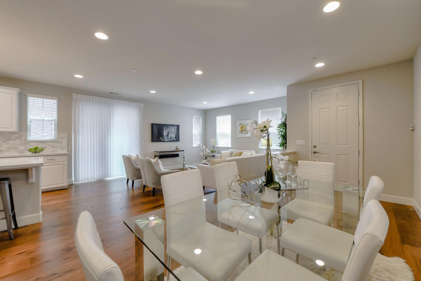 171 Cobblestone Loop Milpitas, CA 95035 - Photo 3 of 41 a living room with furniture a wooden floor and a view of kitchen