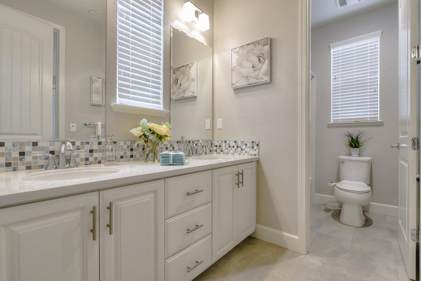 171 Cobblestone Loop Milpitas, CA 95035 - Photo 34 of 41 a bathroom with a toilet sink and mirror