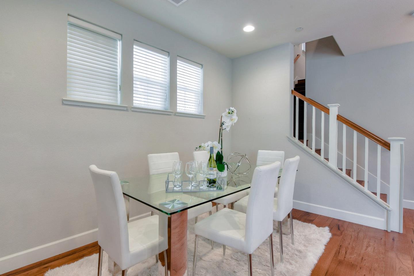 171 Cobblestone Loop Milpitas, CA 95035 - Photo 4 of 41 a view of a dining room with furniture and wooden floor