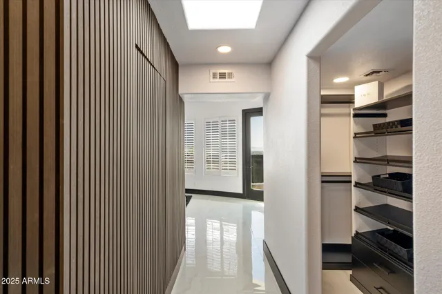 a view of a hallway with a livingroom