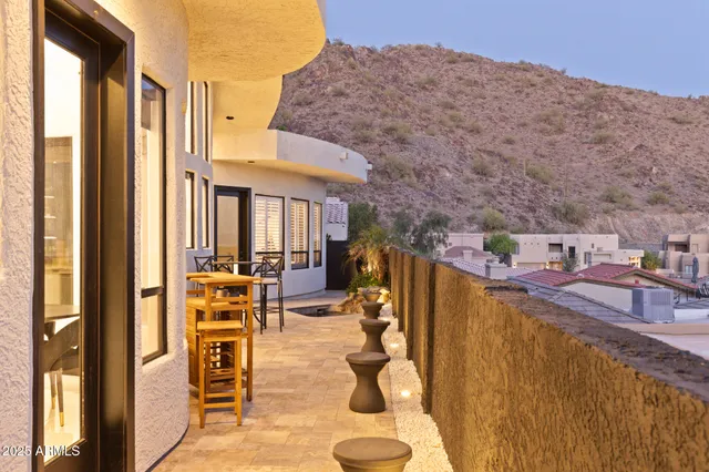 a view of a patio with couches chairs and potted plants
